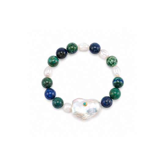 Top-down flat studio shot of elastic stretch beaded bracelet, mixed textured turquoise, dark blue mineral beads and one large luminous irregular white baroque freshwater pearl focal on clean white background