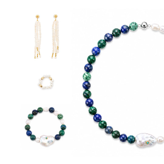Flat lay white studio shot of complete four-piece neutral mixed stone pearl jewelry set, matching turquoise baroque pearl necklace, stretch bracelet, oval pearl ring and long tassel drop earrings arranged together