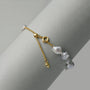 Adjustable clasp and extension chain detail of 18k gold-plated keshi bracelet