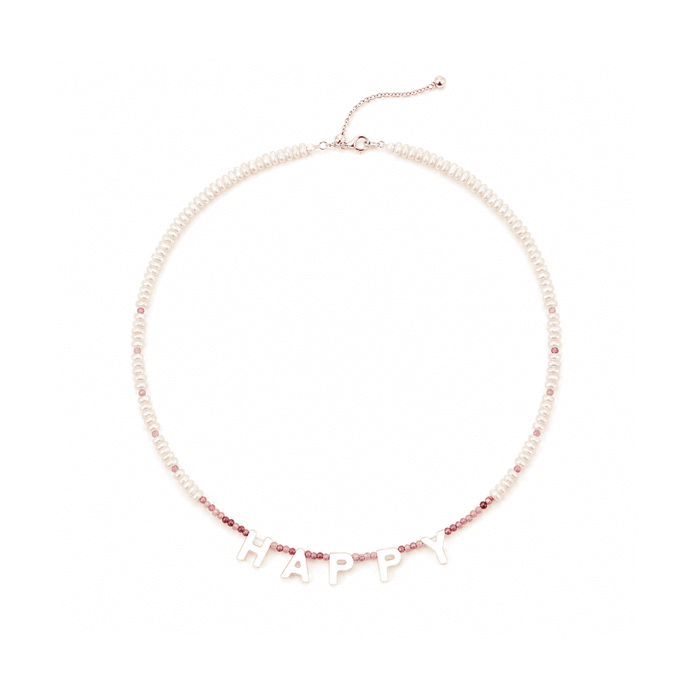 Alternating pink tourmaline and freshwater pearl bead texture close-up