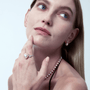 Model styling the pearl ring with matching pearl necklace