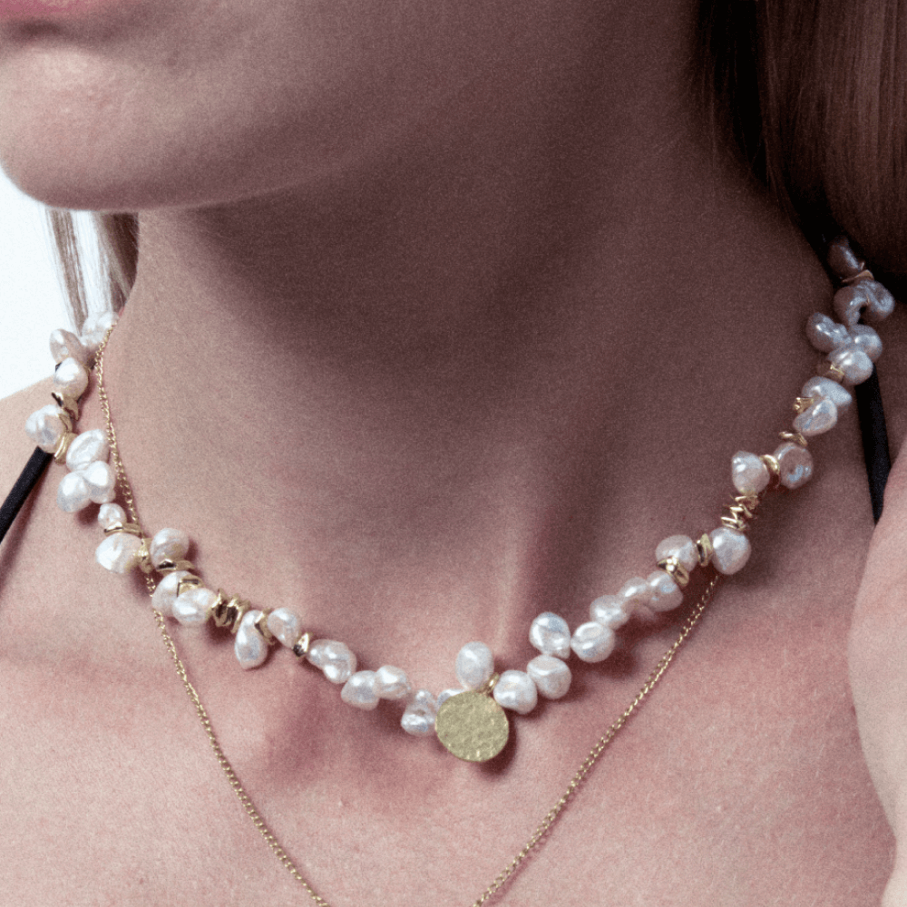 Best quality natural pearl necklace with gold disc, featuring irregular and uneven shapes and deep-nacre luster