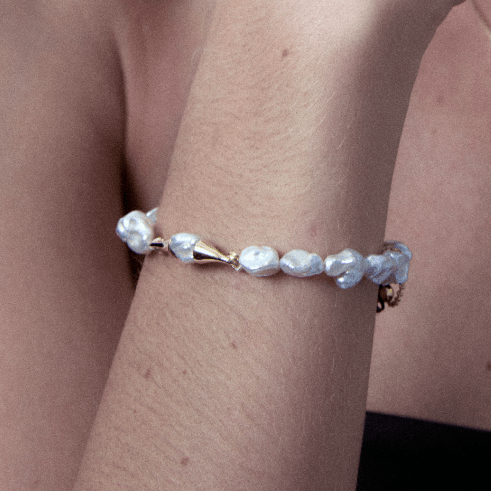 Keshi pearl bracelet with gold accents worn on wrist