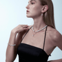 Model wearing dainty Keshi pearl pendant with black dress
