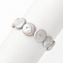 Clean white studio shot of coin button baroque pearl bracelet, smooth luminous flat round white freshwater baroque pearls 
