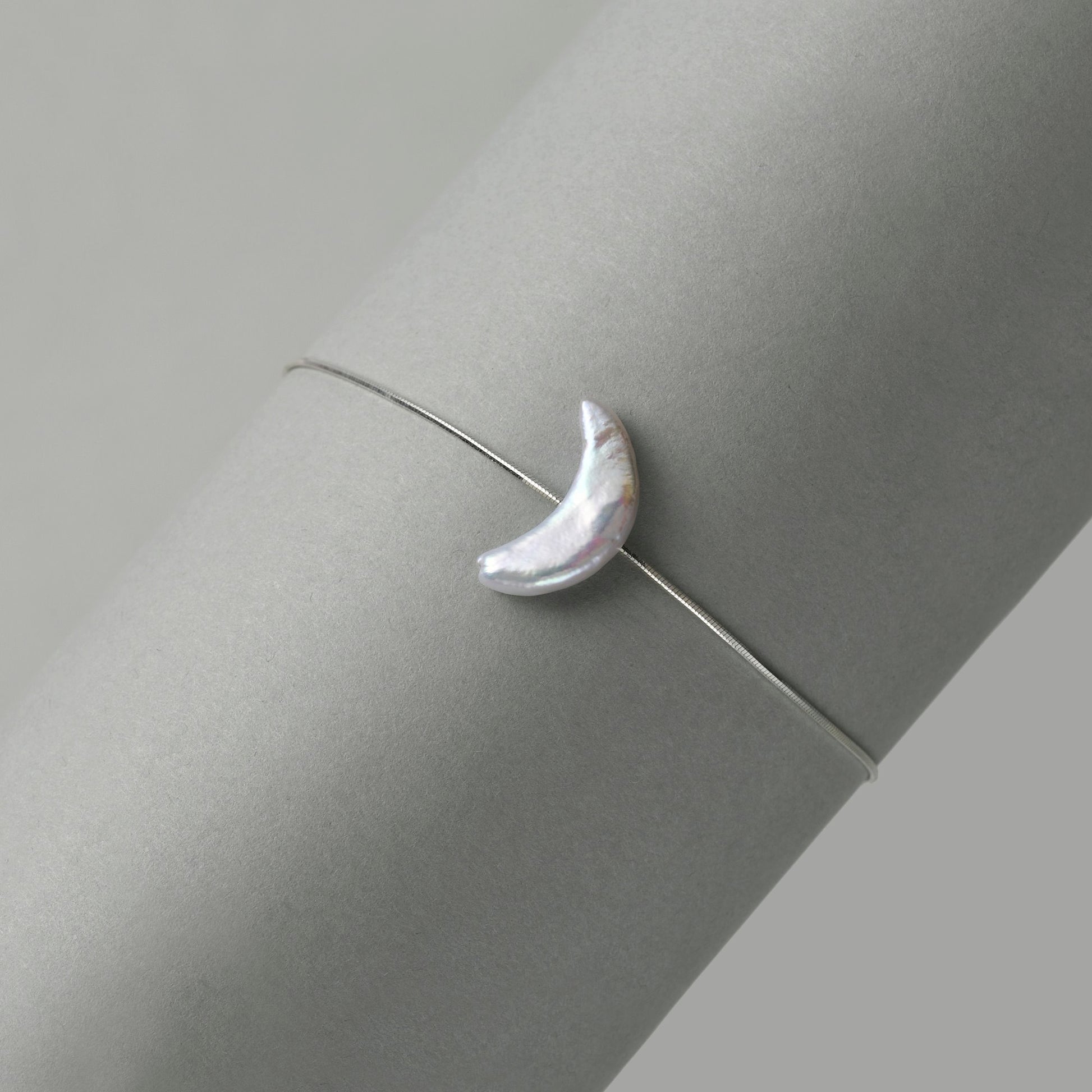 Close-up of crescent moon baroque pearl texture and luster
