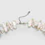 Close-up of keshi stick pearl texture and sterling silver clasp detail