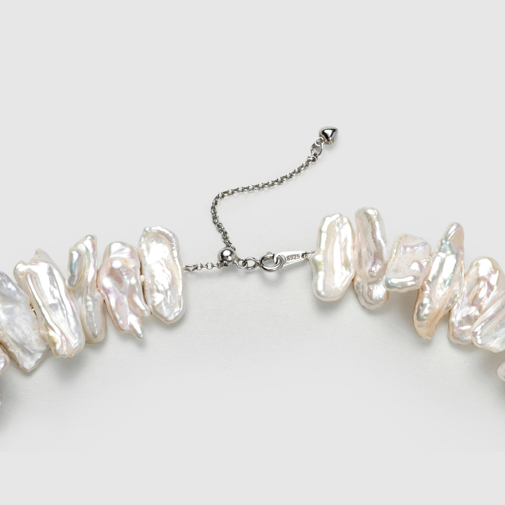 Close-up of keshi stick pearl texture and sterling silver clasp detail
