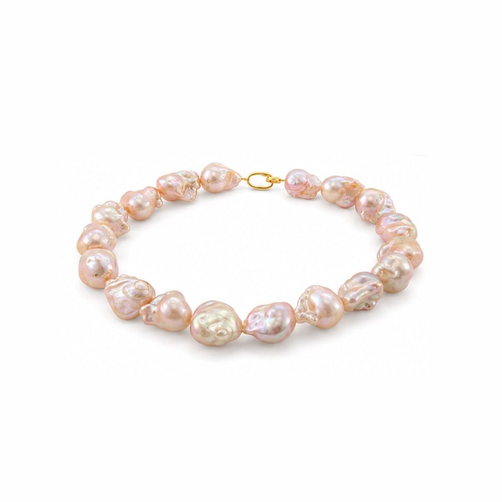 Close up of 15–24mm golden baroque pearls necklace with pink-gold luster
