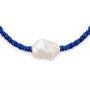 Close up of 18–24mm baroque pearl and deep blue lapis lazuli beads