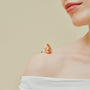 Close up of 20-24mm golden baroque pearl and polished silver open band