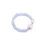 Close up of pink baroque pearl and faceted blue chalcedony beads with silver spacers