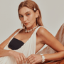 Model styling the stick pearl choker with elegant  outfit