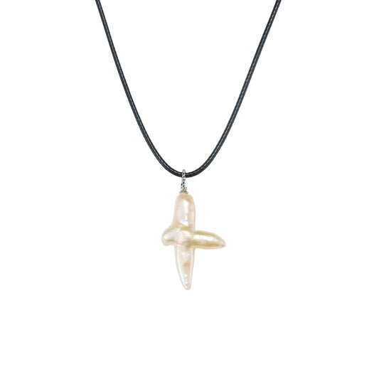 Unisex baroque cross pendant featuring a natural cross shaped pearl on a minimalist black hide rope.