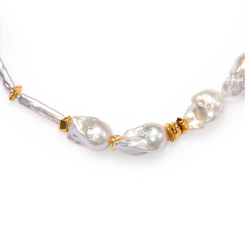 Sculptural freshwater baroque pearls mixed with golden metallic details