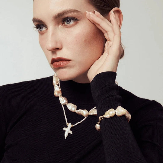 Warm champagne golden baroque freshwater pearl jewelry trio, featuring large baroque choker, cross pendant fine necklace & matching pearl ring, polished gold tone, vintage gentle style for daily layered wear and special occasion styling.