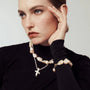 Warm champagne golden baroque freshwater pearl jewelry trio, featuring large baroque choker, cross pendant fine necklace & matching pearl ring, polished gold tone, vintage gentle style for daily layered wear and special occasion styling.