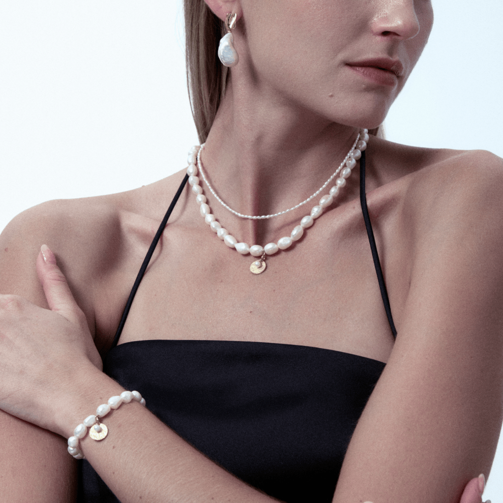 Natural freshwater baroque pearl necklace stacking on model