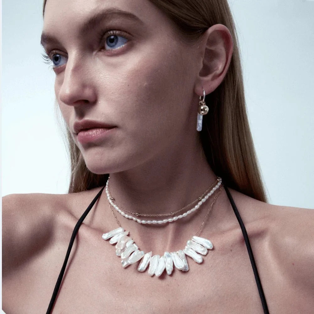 S.Orb | White Stick Baroque Pearl Gold Earrings model view