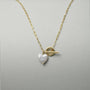Heart shaped pearl pendant with a front toggle clasp, a unique anniversary gift for her featuring modern baroque pearls.