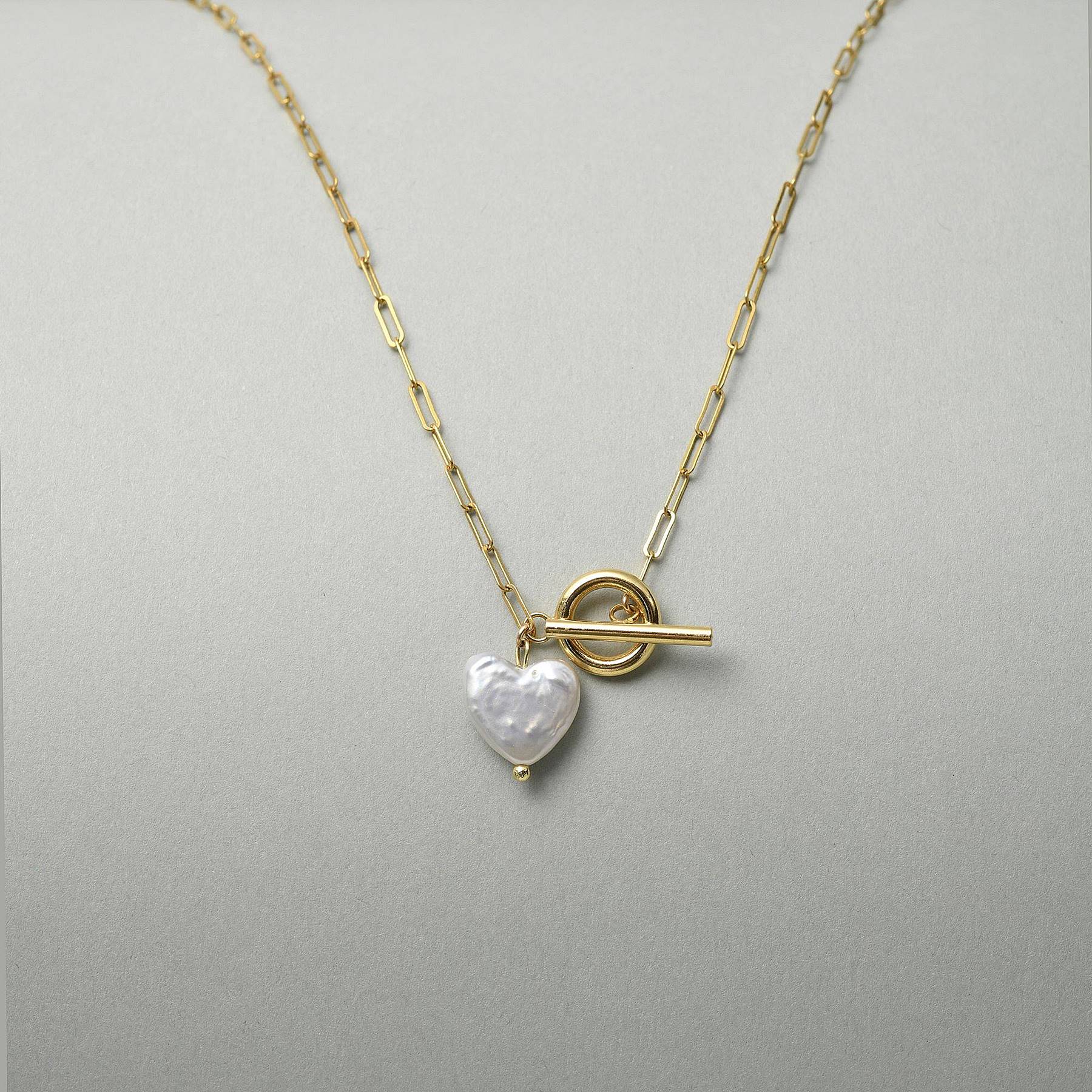 Heart shaped pearl pendant with a front toggle clasp, a unique anniversary gift for her featuring modern baroque pearls.