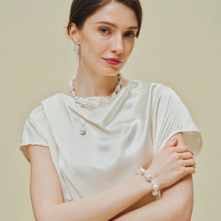 Layered bold statement baroque pearl jewellery set on model