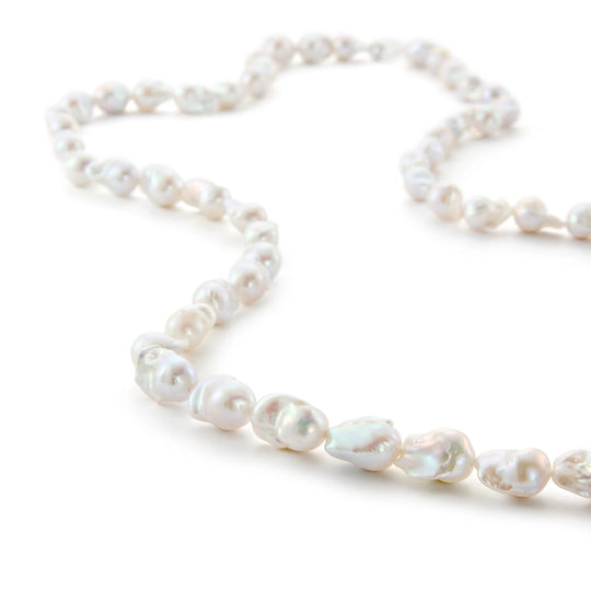 Long full strand large white natural irregular baroque pearl necklace