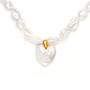 close-up look of heart shaped pearl necklace , ethereal bridal jewelry for weddings and special occasions.