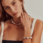 Ethereal view of a model wearing the best quality metallic purple baroque necklace. A perfect staple for daily outfit.