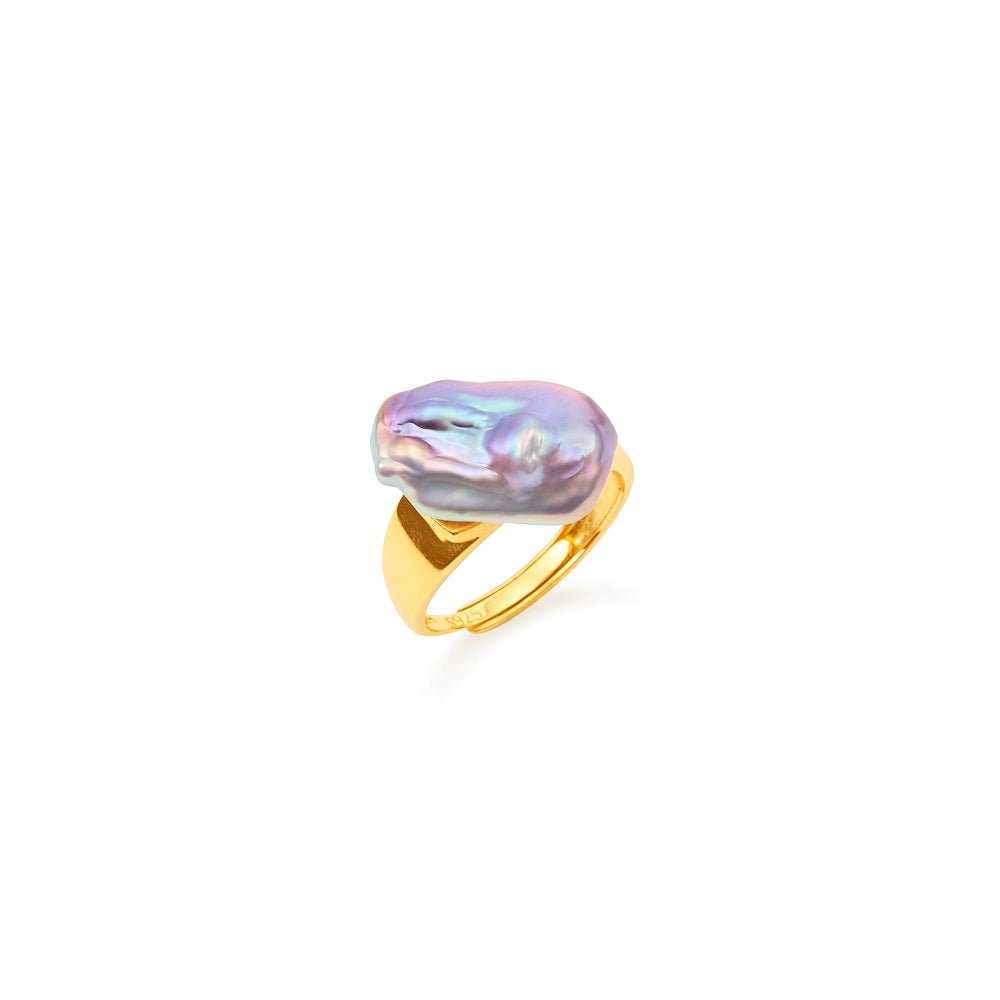 Minimal white studio close-up of twisted 18k gold open band ring, highlighting glossy iridescent texture of large natural purple baroque freshwater pearl