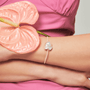 Model wearing pink beaded baroque pearl bracelet on wrist lifestyle shot