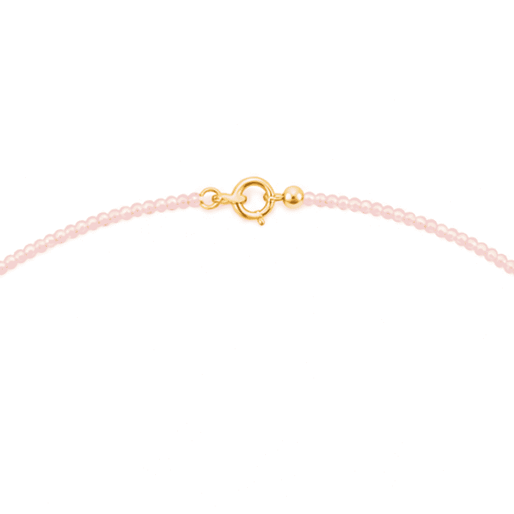 Polished gold spring ring clasp detail of dual pearl station necklace