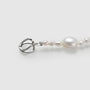 Close-up of the secure sterling silver clasp on a handcrafted unisex pearl cross necklace.