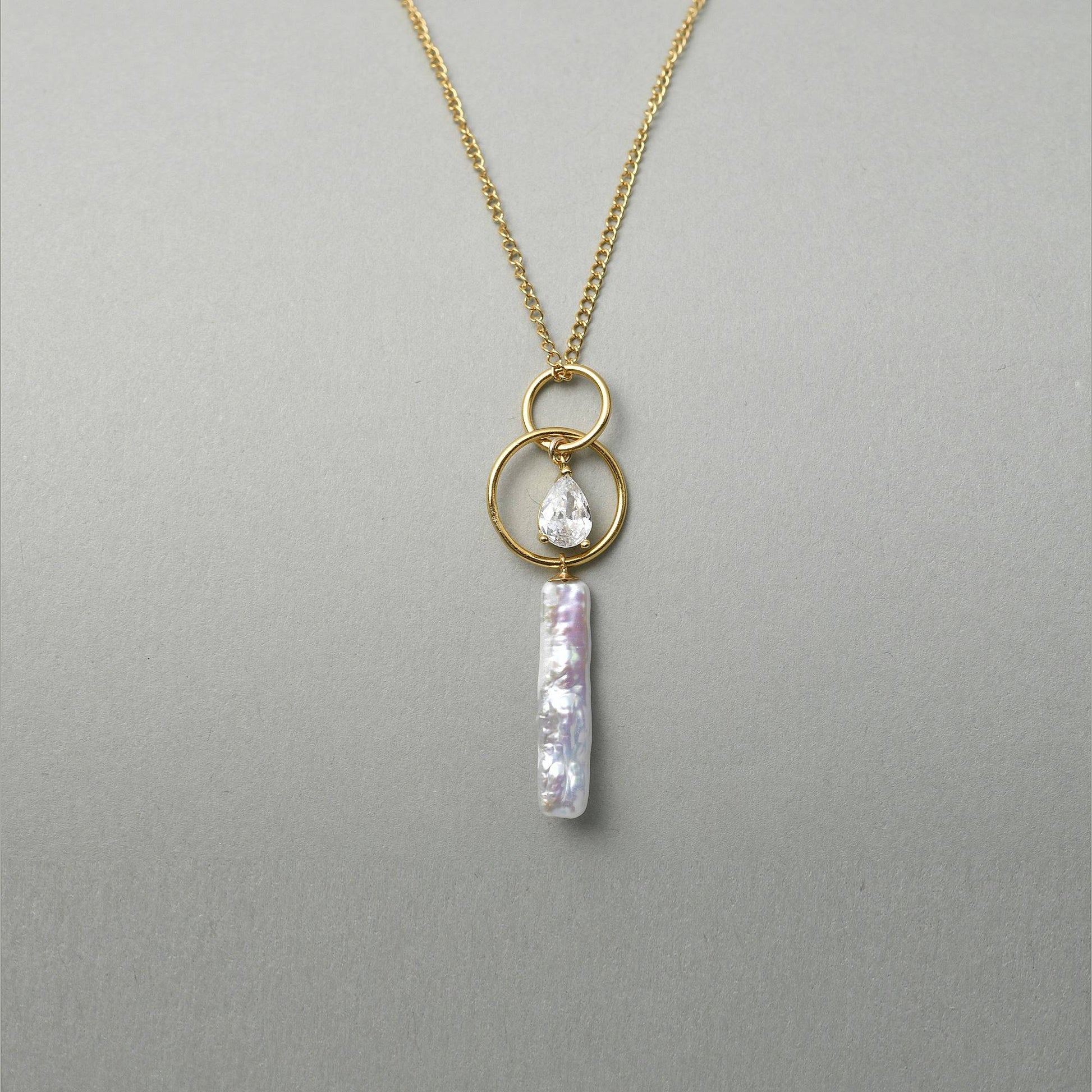 Close up vertical stick baroque pearl and teardrop crystal detail