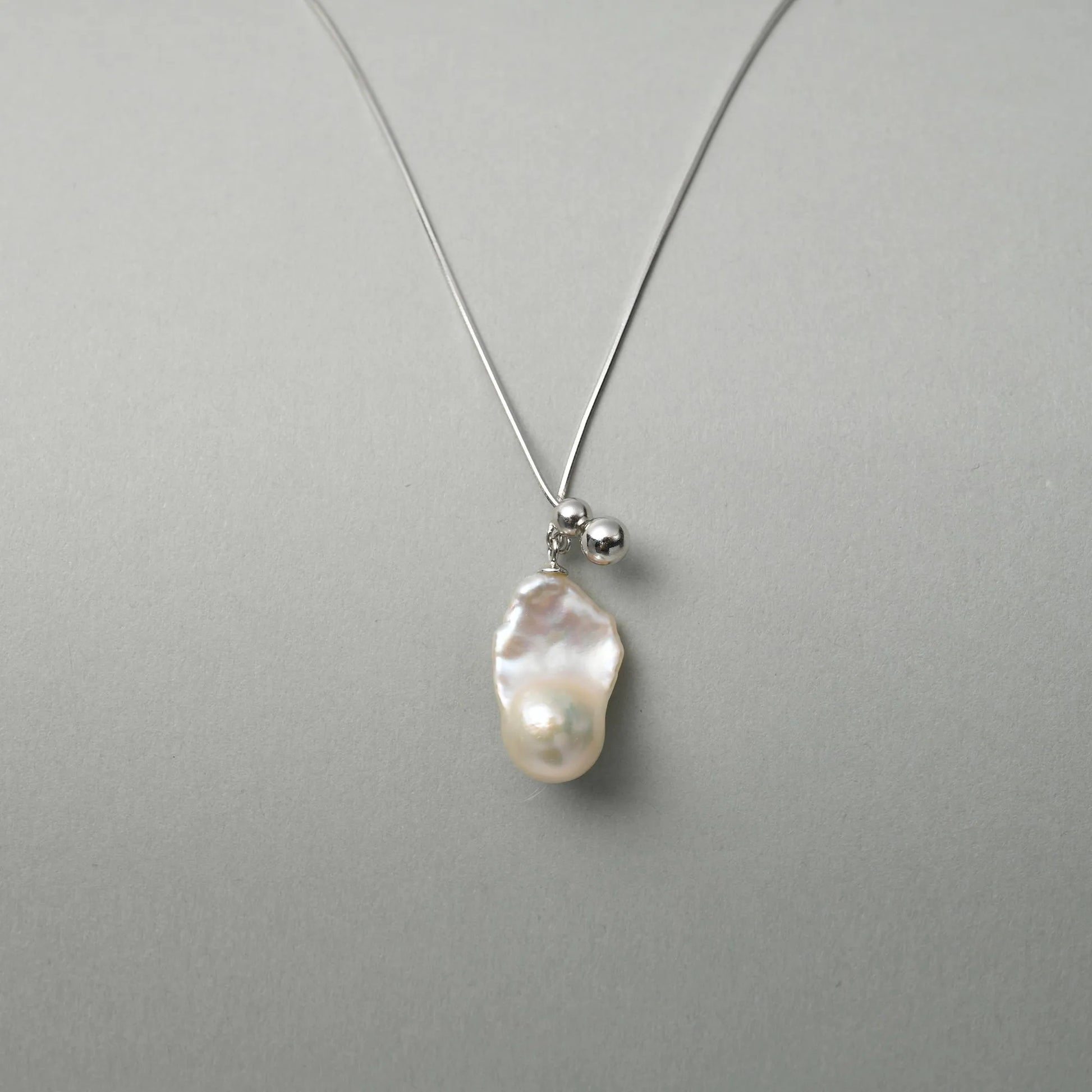 Sacra | White Baroque Pearl Silver Orb Pendant