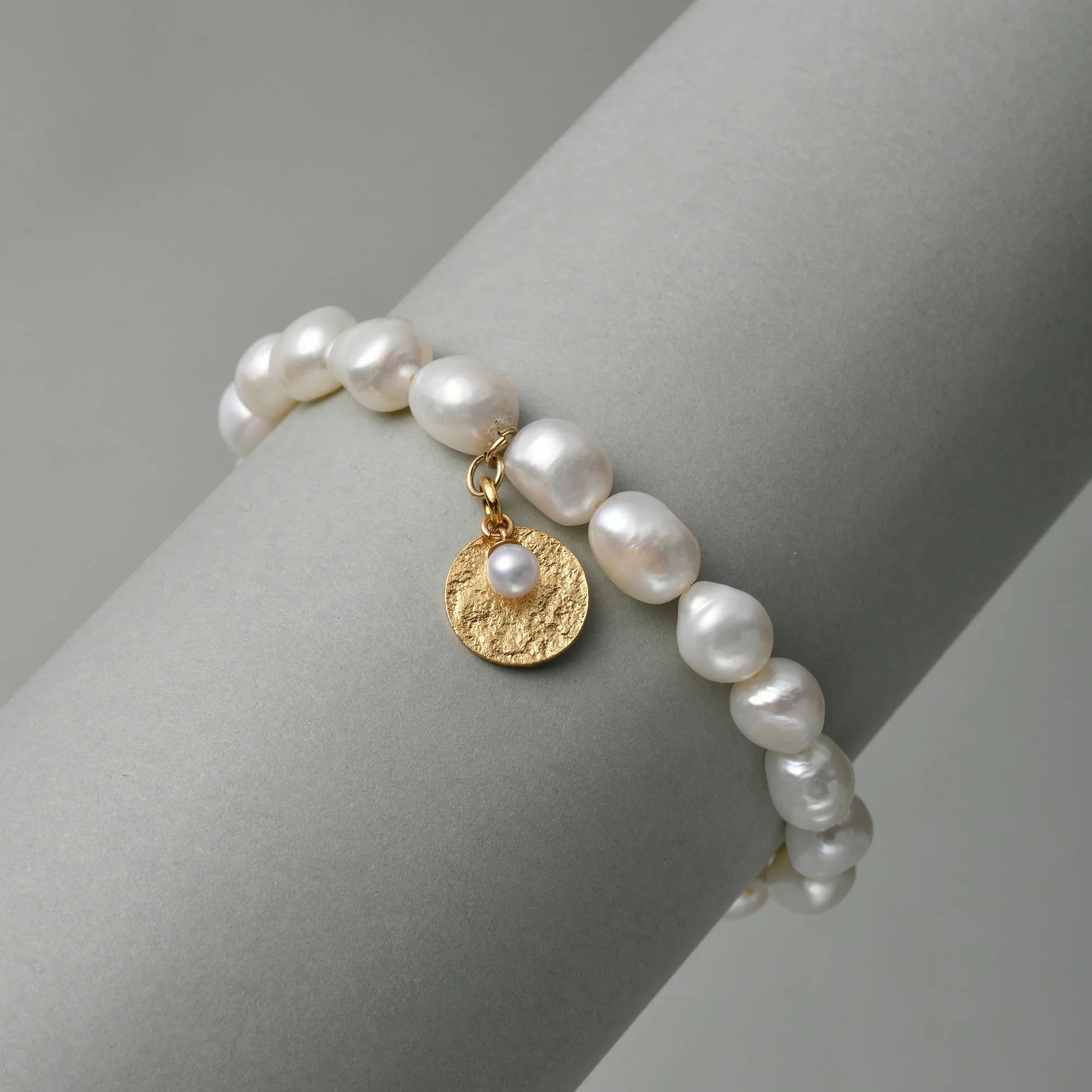 White Oval Baroque Pearl 18k Gold Charm Bracelet studio shot