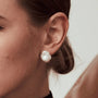 Sulu silver pearl stud earrings model view 1
