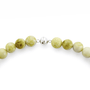Silver clasp detail of serpentine pearl beaded necklace