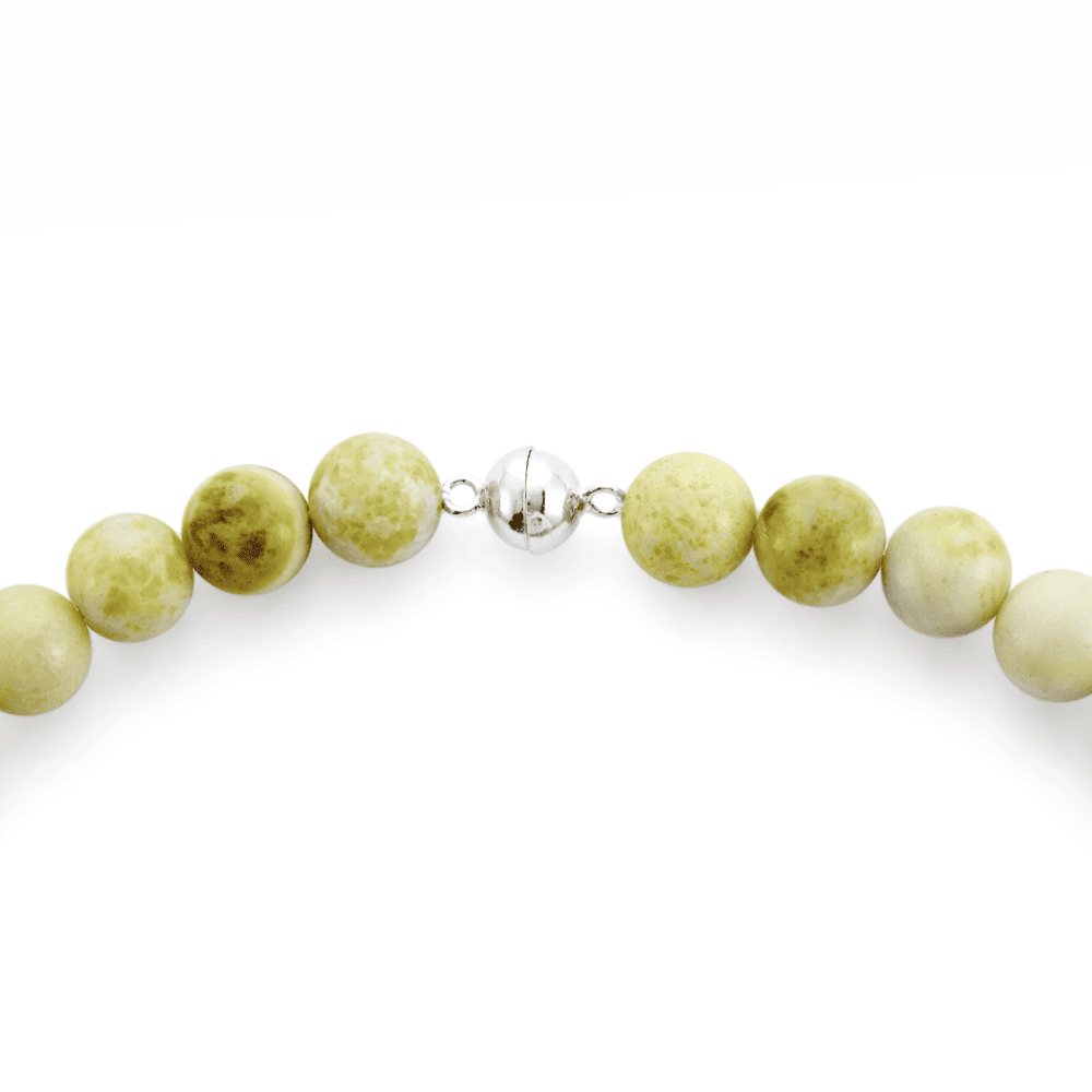 Silver clasp detail of serpentine pearl beaded necklace