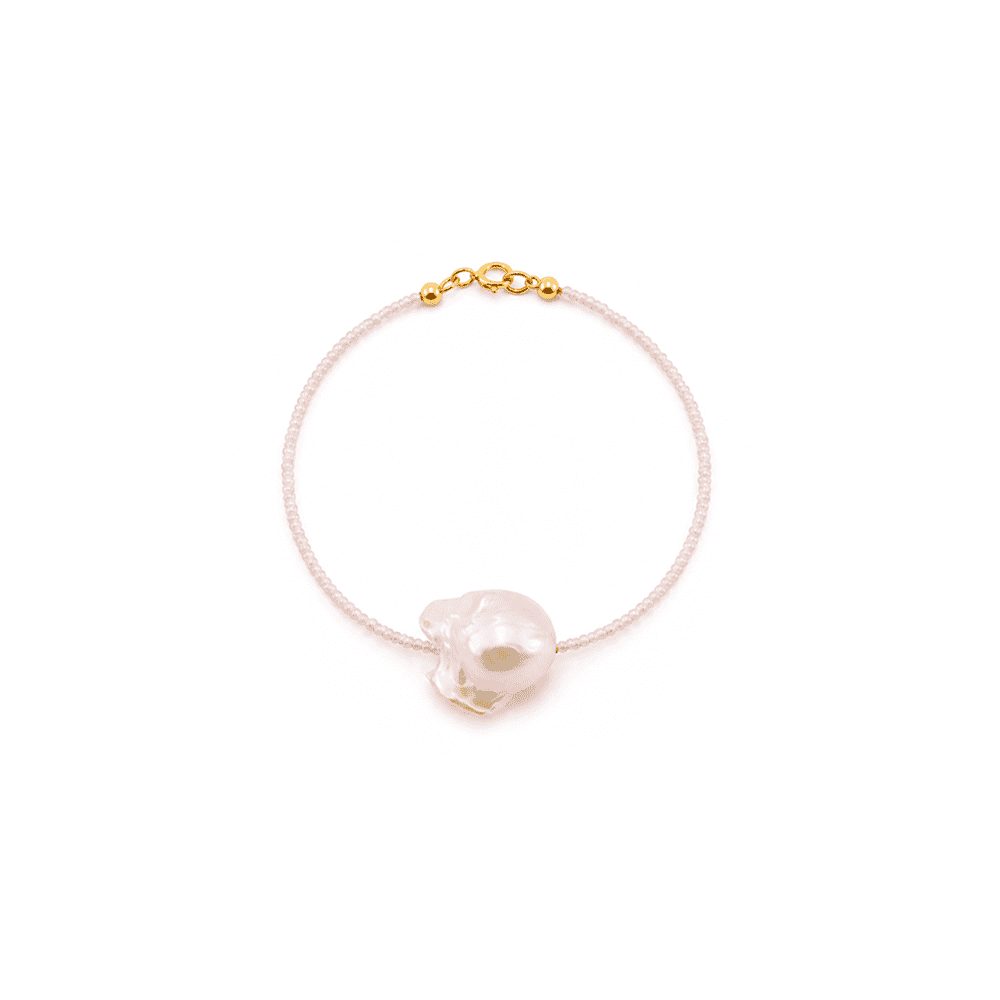 Soft matte pink beaded strand texture close-up of baroque pearl bracelet