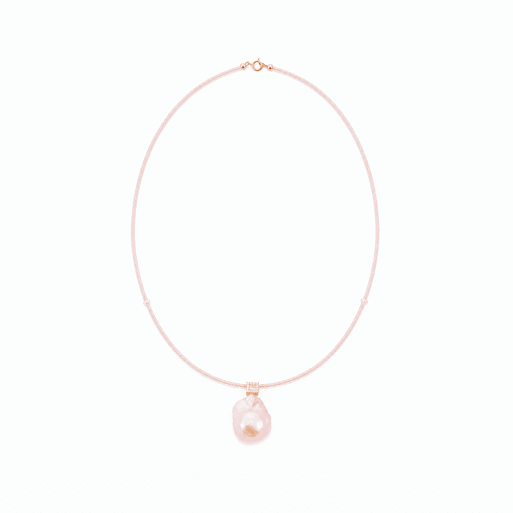 Soft pink beaded strand detail of baroque pearl necklace