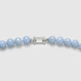 Close-up of silver clasp and light blue lapis lazuli bead details