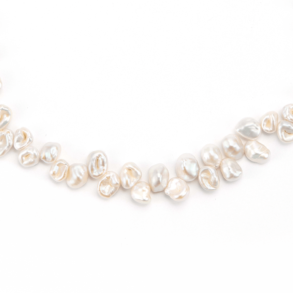 Close-up shot of natural Keshi pearl surface luster detail