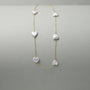 Heart shaped pearl necklace with a romantic vibe, a versatile piece for music festival outfits and summer holiday styling.
