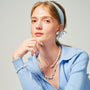 Woman wearing the Celeste keshi pearl and rock crystal necklace around her neck