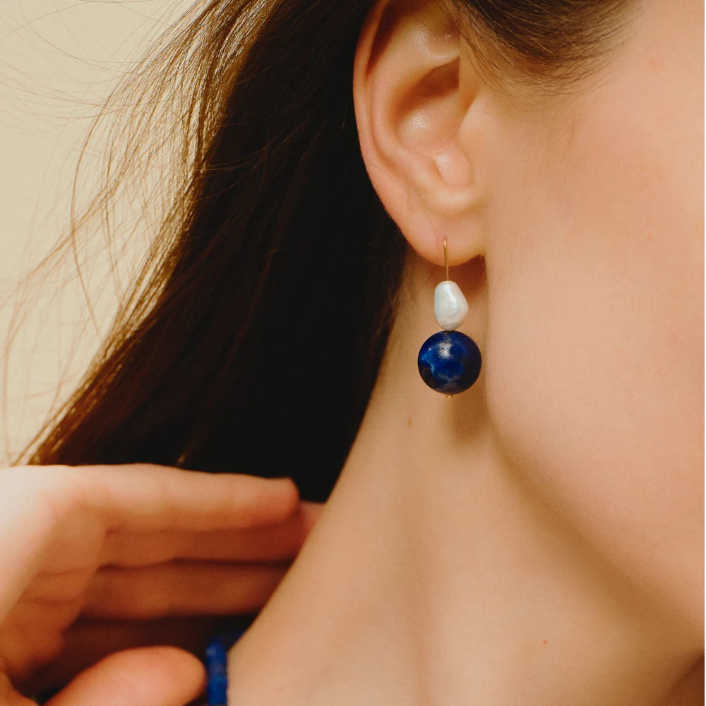 close up of pearl lapis earrings 