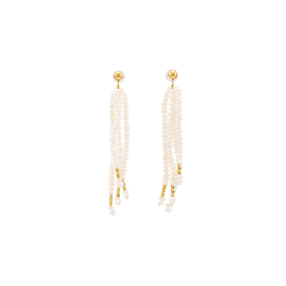 Clean white background overhead shot of pair of long tassel drop earrings, multi-strand tiny smooth white oval freshwater pearls with polished 18k gold plated studs and metal accents