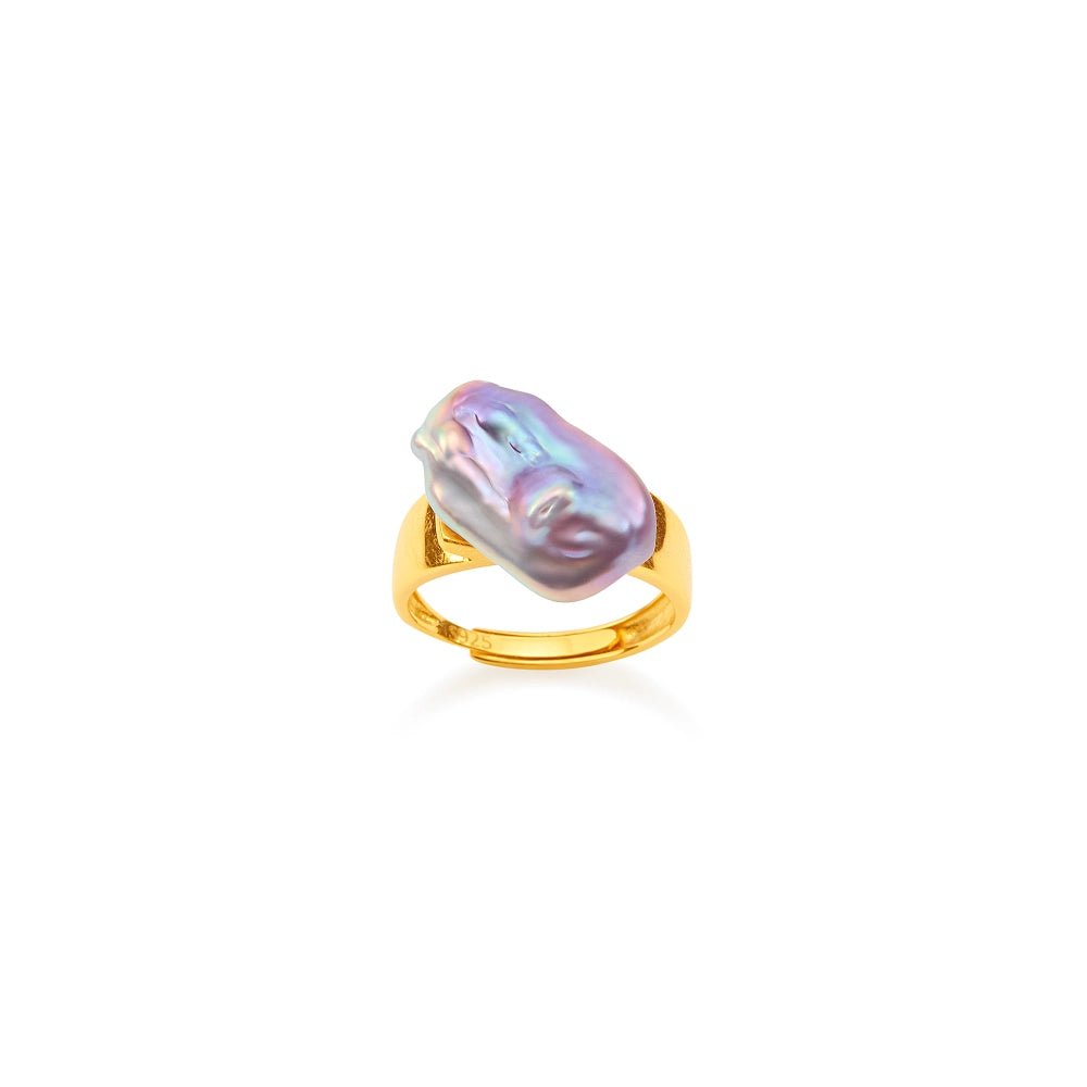 Clean white background overhead shot of 18k gold open band ring, set with one large luminous iridescent purple irregular baroque freshwater pearl focal stone