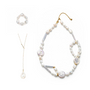 Elegant Poppy baroque pearl jewelry set with choker, lariat necklace & ring. Natural freshwater irregular pearls, 18k gold hardware, customizable chain lengths for daily & formal styling.