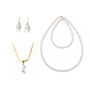 Minimal flat lay of Luna moon pearl 4-piece stacking set, baroque pearl 18k gold drop earrings, moon pearl herringbone pendant necklace, two lengths of uniform white freshwater pearl bead strands